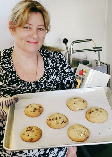 Bonnie pictured with tray of cookies for Melting Pot Candy